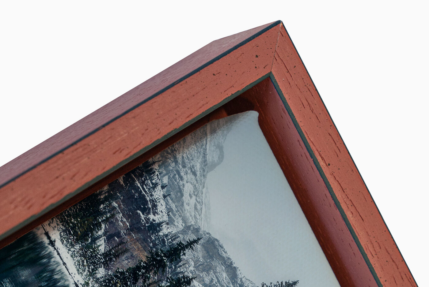 Detailaufnahme eines Rahmens mit einem Landschaftsbild, schön gestaltet