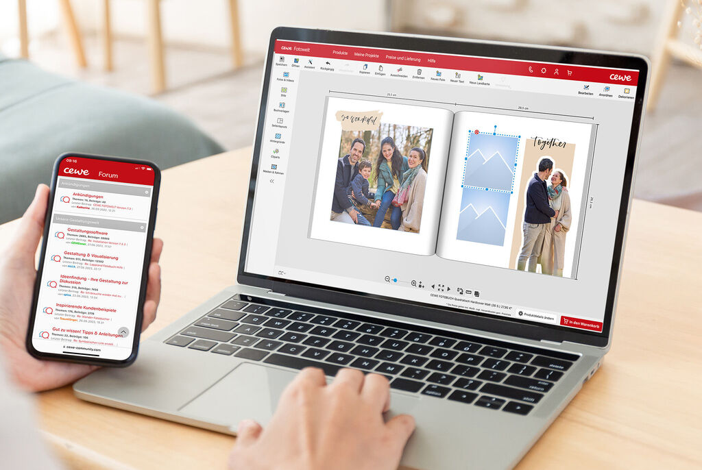 Benutzer arbeitet mit dem CEWE Fotobuch auf Laptop und Smartphone.