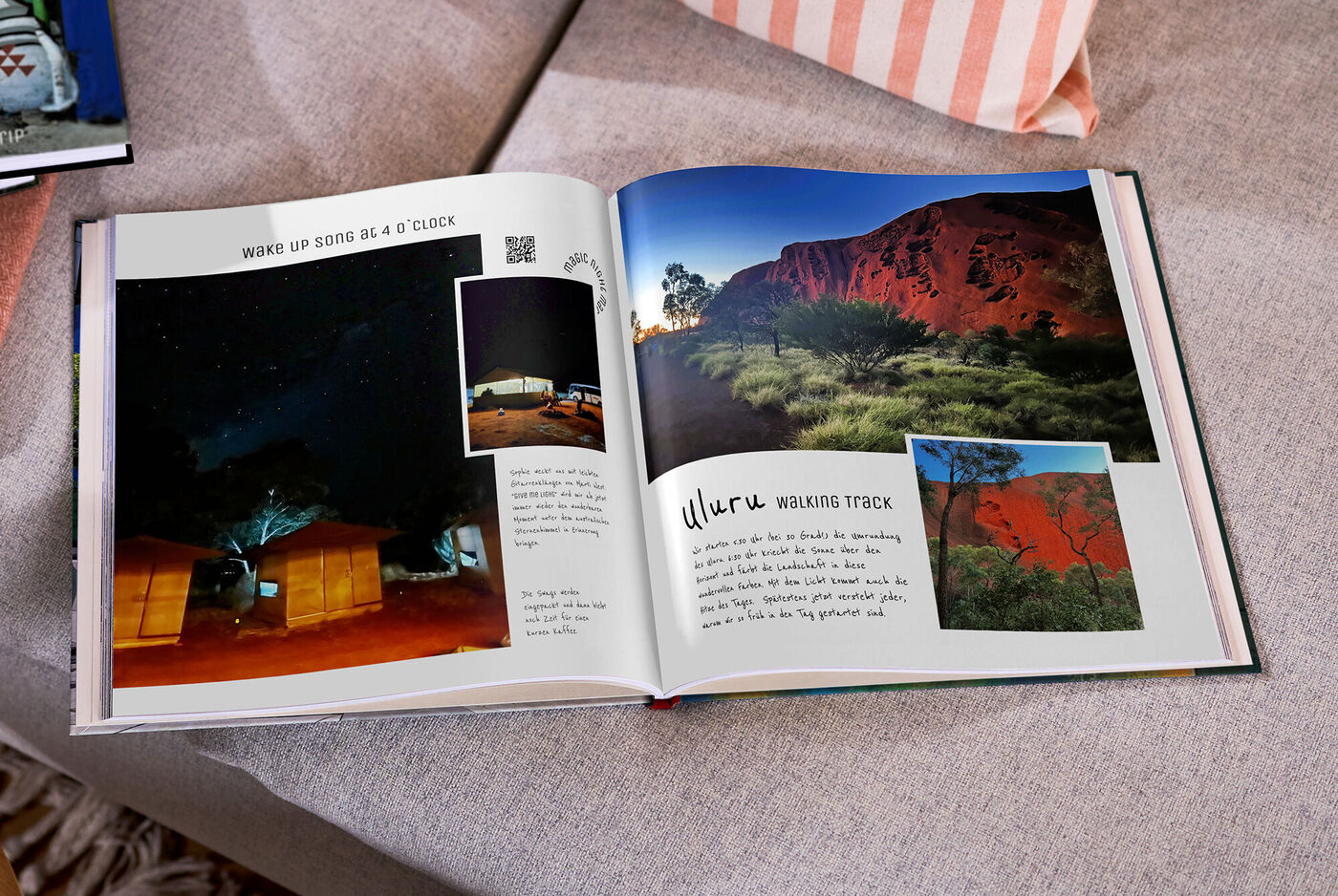Offenes CEWE FOTOBUCH mit Nachtcamp und roten Felsen am Uluru.